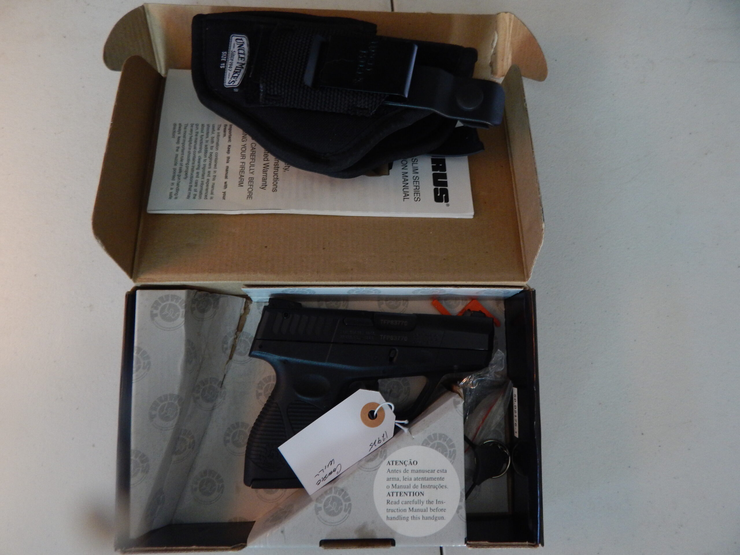 Taurus PT 709 Slim 9mm W/ uncle mikes holster 1 mag